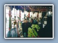 Carolyn and Adrienne with Julianna on the carousel in Monterey
